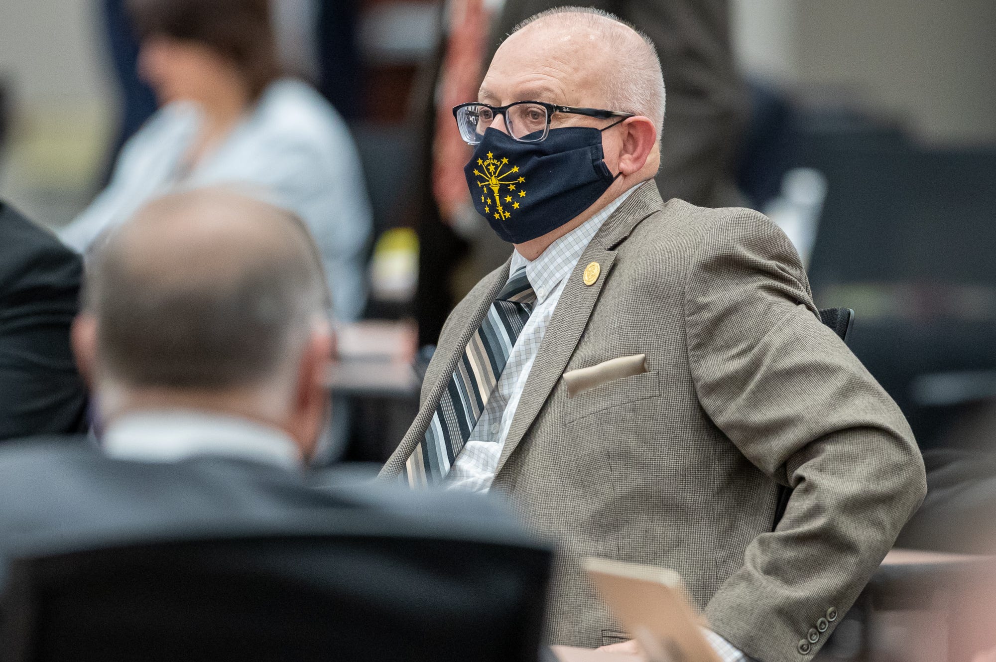 Rep. Doug Miller sits at his desk as the Indiana House meets on Monday, Feb. 8, 2021, inside the temporary chamber at the Government Center South in Indianapolis.
