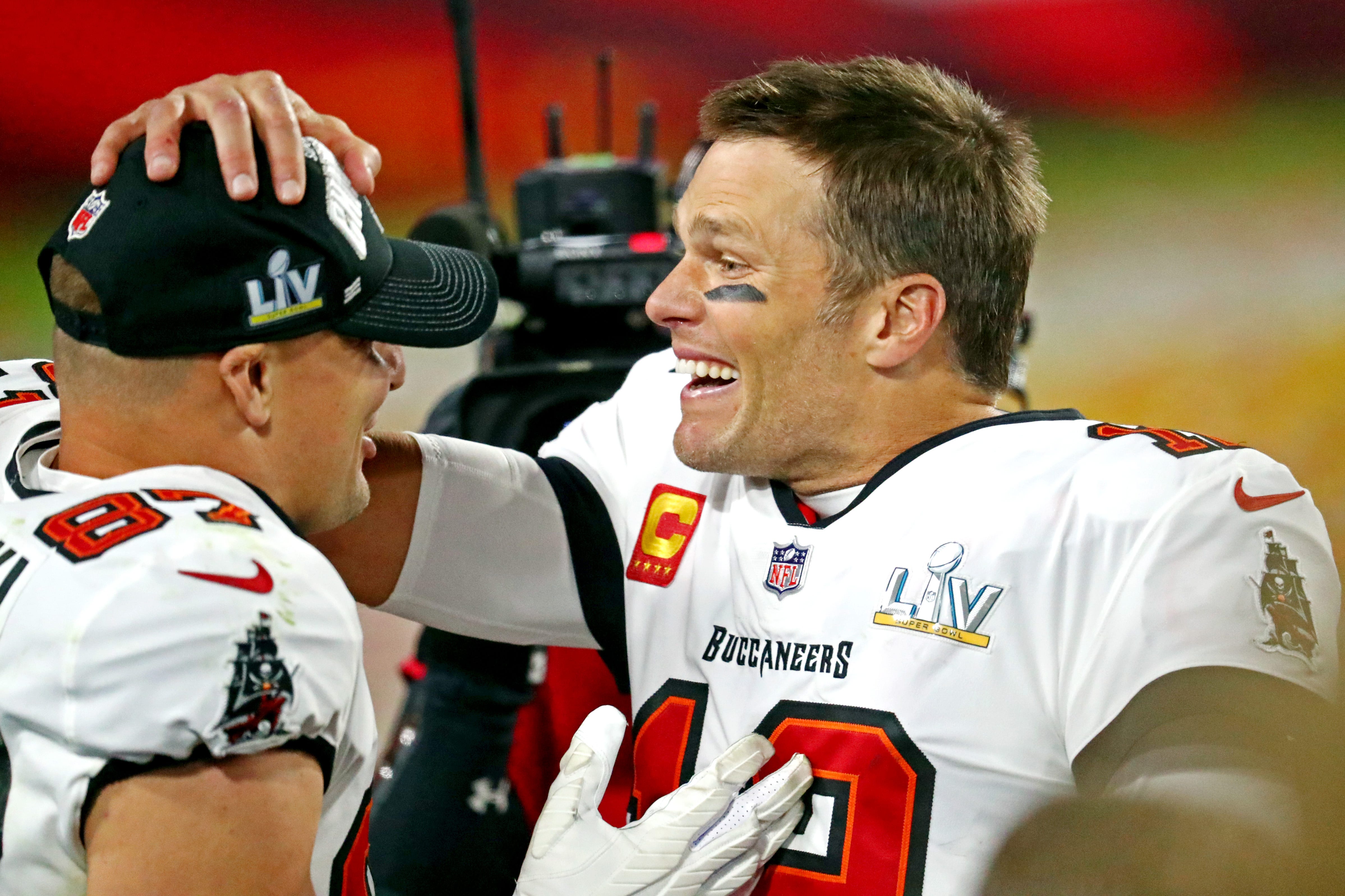 Tampa Bay Buccaneers quarterback Tom Brady (12) and tight end Rob Gronkowski (87) celebrate after beating the Kansas City Chiefs in Super Bowl 55 at Raymond James Stadium.
