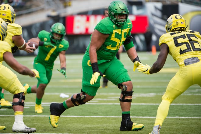 Oregon offensive tackle Penei Sewell (58), shown blocking during a game in 2019, could play on either side of the offensive line.