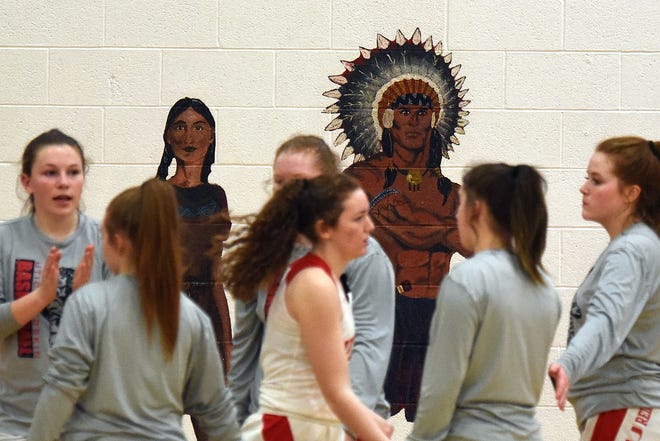 The Utica High School girls basketball team takes the court on Monday, Feb. 8, 2021 for a home game. On the far wall of the gym is a mural of a Native American woman and man. The North Fork School Board voted 5-0 against officially exploring the possibility of changing Utica's Redskins nickname.