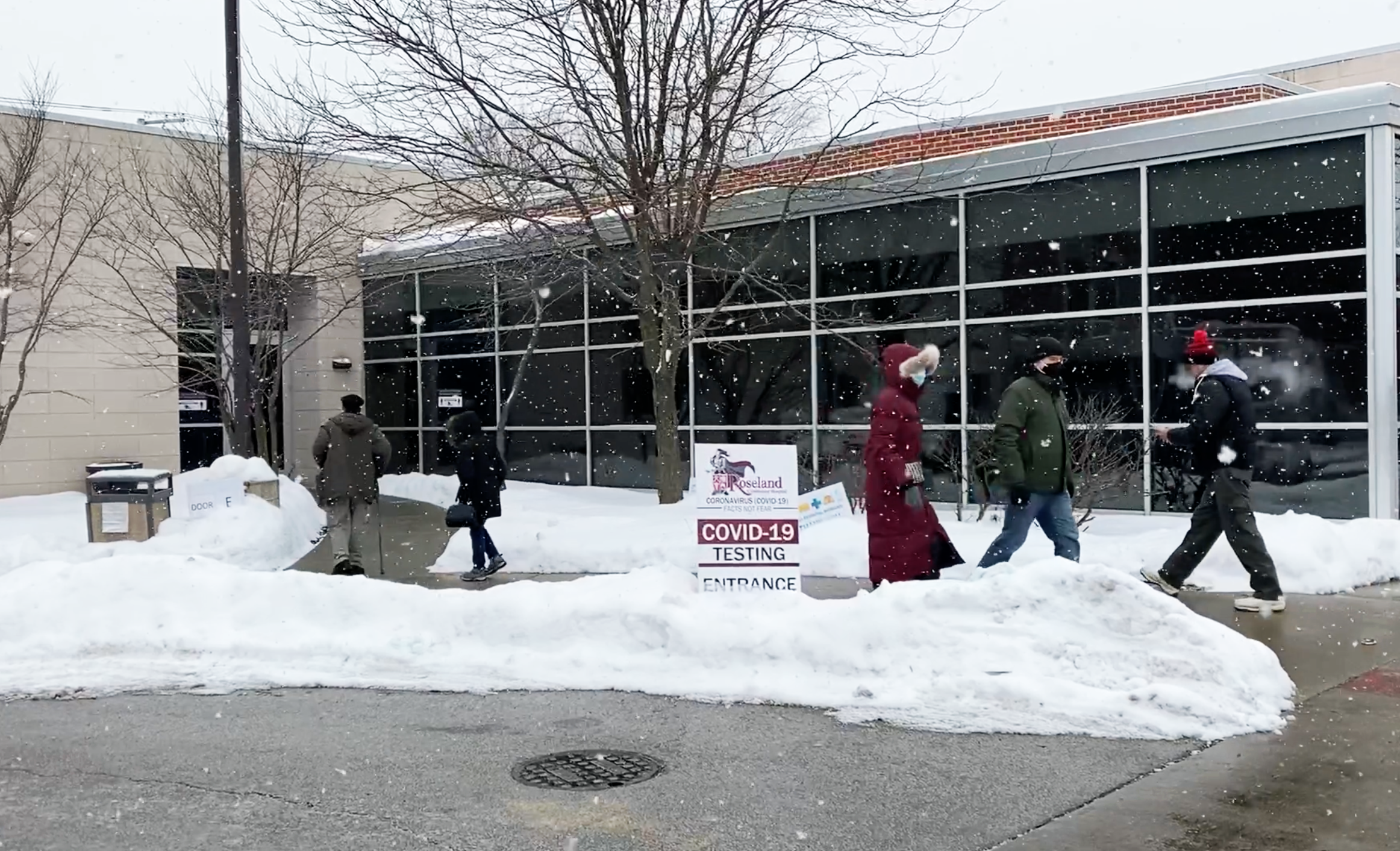 Patients enter and exit the vaccination and testing site at Roseland Community Hospital on Chicago's far south side on Feb. 8, 2021. Many receiving vaccinations at the hospital were not locals and hailed from neighborhoods across the city.