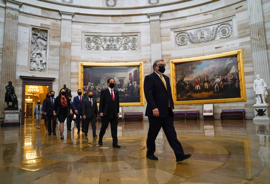 Rep. Jamie Raskin, D-Md., second from right, and other House Managers walk through the United States Capitol rotunda on the way to the Senate Chambers to begin the second impeachment trial of former President Donald Trump.  Trump faces a single article of impeachment charging him with 