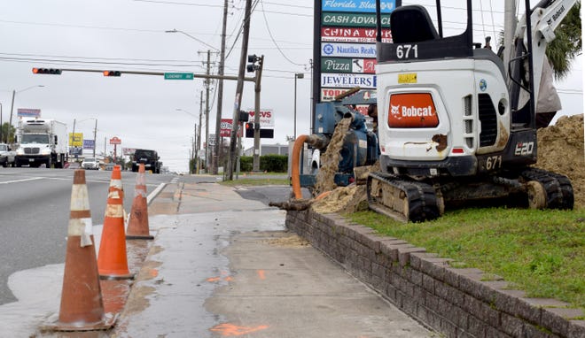 Water flowed along 15th Street on Tuesday as a crew with the Panama City Utilities Department replaces a waterline.