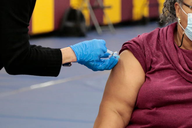 Patients receive their second dose of the Moderna COVID-19 vaccine during a clinic event at New Prospect Baptist Church in the Roselawn neighborhood of Cincinnati on Wednesday, Feb. 10, 2021.