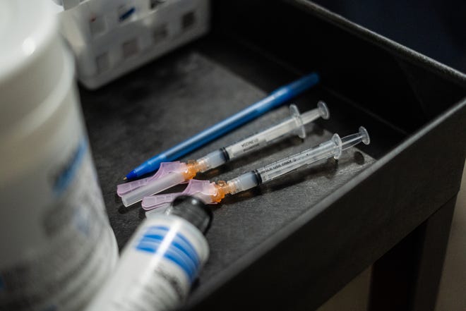 Two doses of the Moderna COVID-19 vaccine wait to be administered in an underground parking garage at TCF Center in downtown Detroit on Wednesday, February 3, 2021.