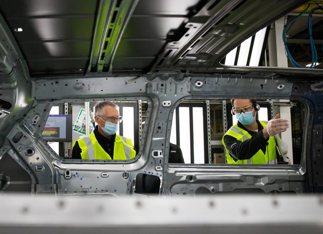 Stellantis CEO Carlos Tavares (left) and Detroit Assembly Complex – Mack plant manager Michael Brieda inspect the steel body of a Jeep® Grand Cherokee L built at the facility as part of a tour on Feb. 9, 2021. Tavares and other members of the Stellantis leadership team visited Mack and the Detroit Assembly Complex – Jefferson plant, home of the Jeep Grand Cherokee and Dodge Durango, to meet with employees and get a firsthand look at those operations, marking their first North American visit since the Stellantis merger was completed last month.