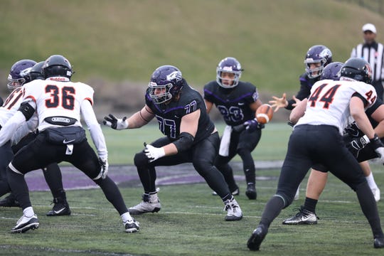 University of Wisconsin-Whitewater Warhawk Quinn Meinerz (77) blocks in a game against Wartburg College Knights. Meinerz is hoping to be drafted in the NFL.
