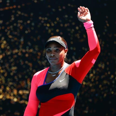 Serena Williams waves after defeating Nina Stojano