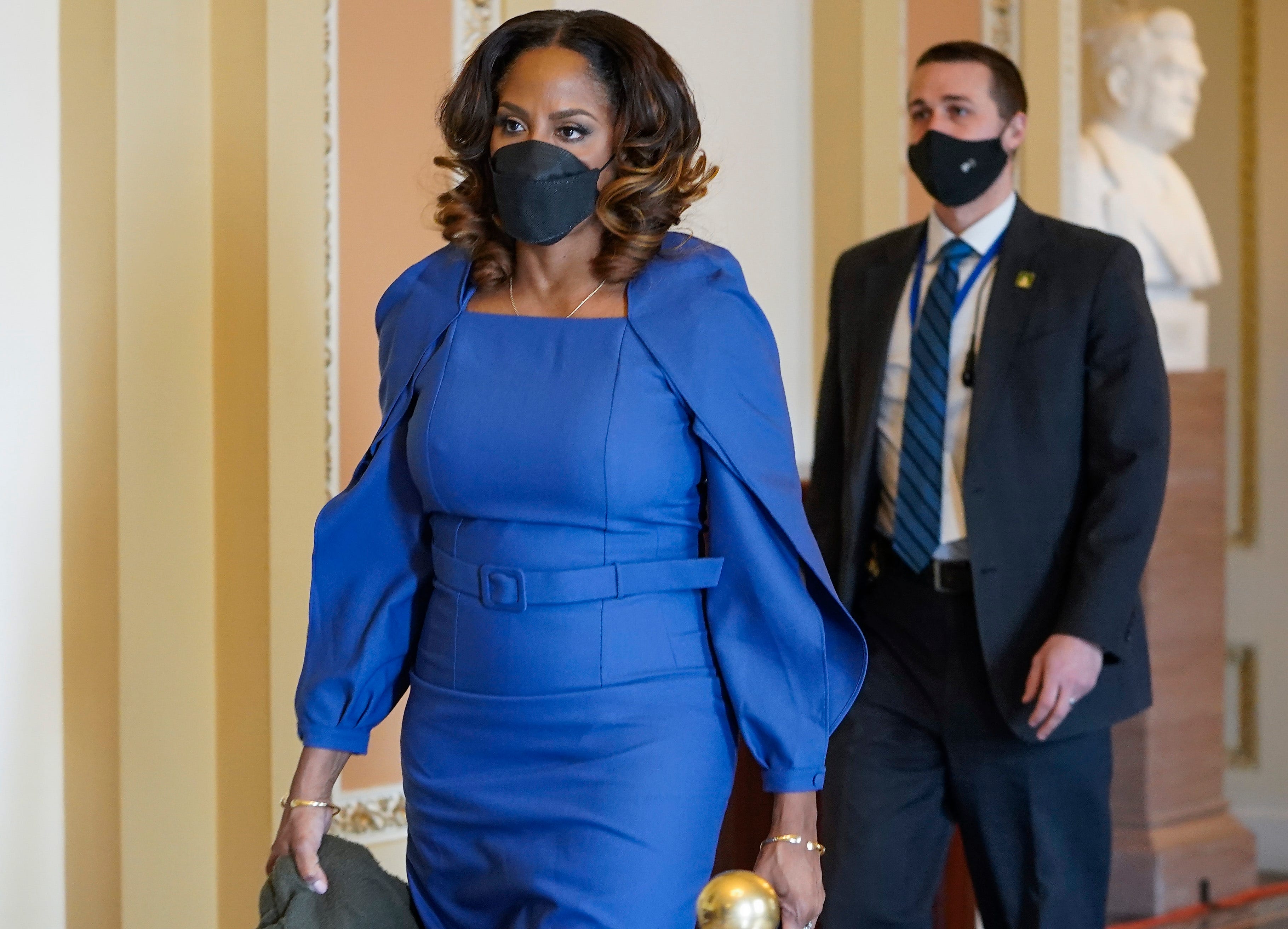Stacey Plaskett, delegate of the U.S. Virgin Islands, arrives to the Senate chamber Wednesday for the impeachment trial of former President Donald Trump. Plaskett is one of the nine House Democratic impeachment managers serving as prosecutors.