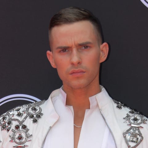 Olympic figure skater Adam Rippon poses at the 201