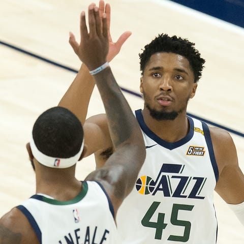 Utah Jazz guard Donovan Mitchell celebrates with R