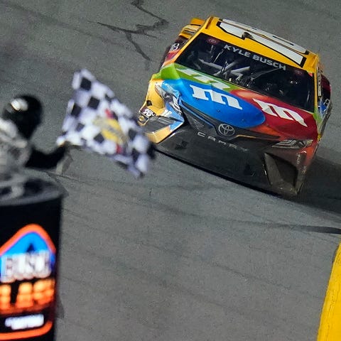 Kyle Busch takes the checkered flag to win the 202