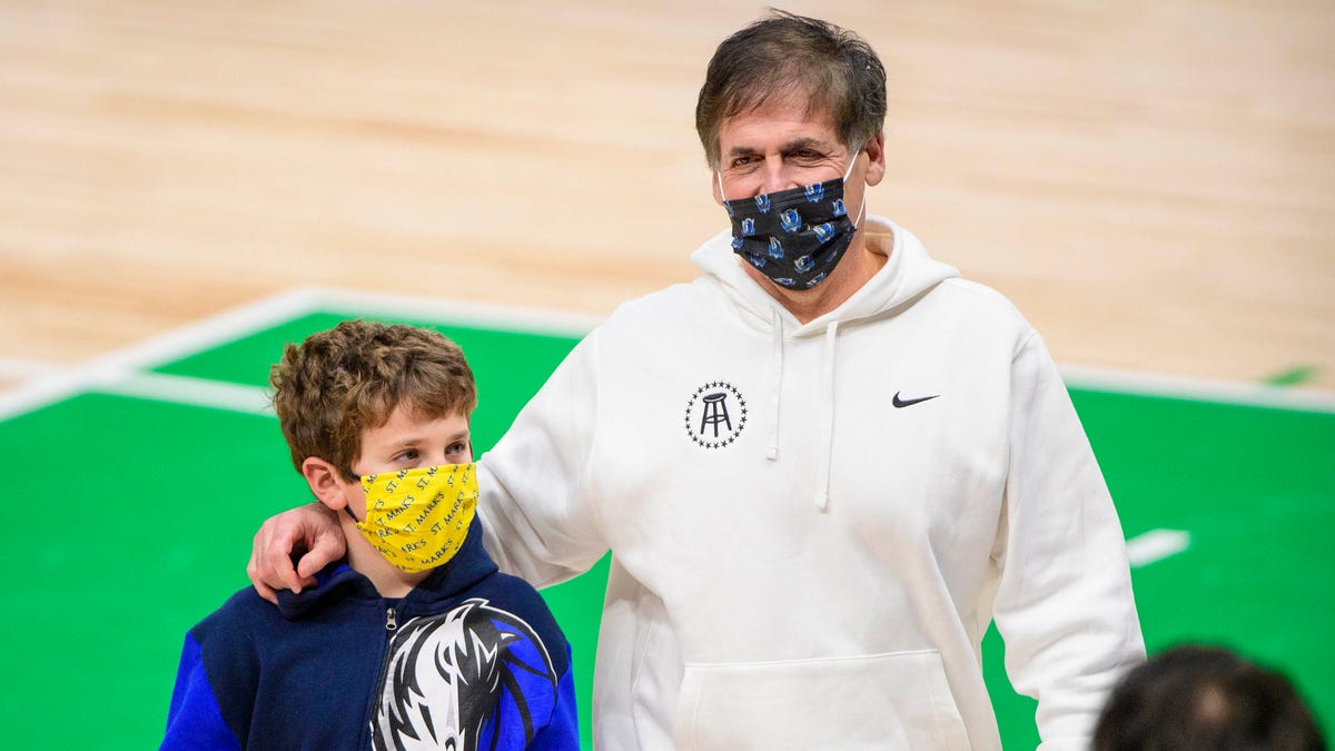 Dallas Mavericks owner Mark Cuban and his son, Jake, after a game between the Mavericks and the Miami Heat in Dallas.