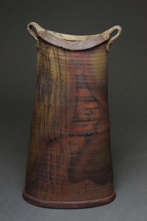 “Tower Vase,” by Jeff Brown, is an oval, wood-fired and reduction cooled ceramic work.
