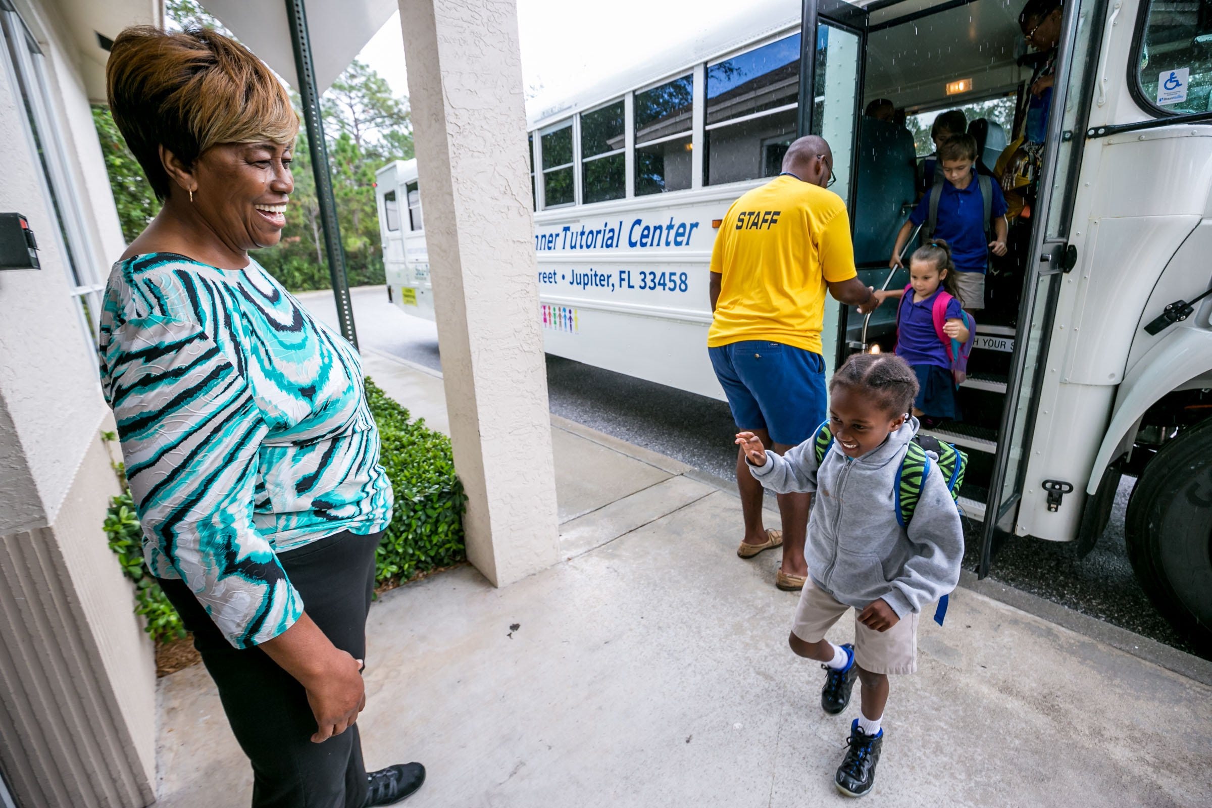 In this 2018 photo, Edna Runner greets children arriving to her namesake tutorial center in Jupiter.