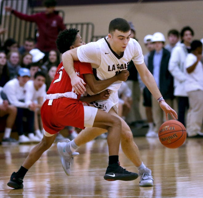 Raphel Awa (right, in action from last year) had a strong performance Wednesday night in helping the La Salle boys basketball team take down Cranston East.