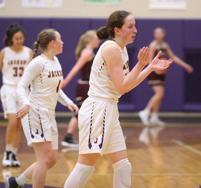 Emma Dretke of Jackson celebrates her basket at the buzzer at the end of the first half during their game against Stow. at Jackson on Wednesday, Feb. 10, 2021.