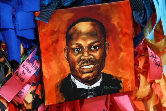 Small oil-on-canvas portraits like this one of 2020 Georgia shooting victim Ahmaud Arbery are a part of an installation created by Detroit artist Carol Morisseau for the "Soul of Black Folks" exhibition.