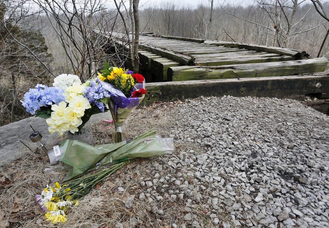 These flowers were left at one entrance to the Monon High Bridge, a spot which Abigail Williams, 13, and Liberty German, 14, were known to have visited on Feb. 13, 2017, on the day they were killed.