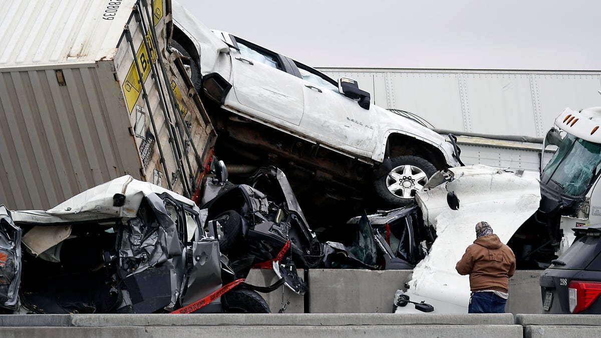 Vehicles are piled up after a fatal crash on Interstate 35 near Fort Worth, Texas on Thursday, Feb. 11, 2021.  The massive crash involving 75 to 100 vehicles on an icy Texas interstate killed some and injured others, police said, as a winter storm dropped freezing rain, sleet and snow on parts of the U.S. 