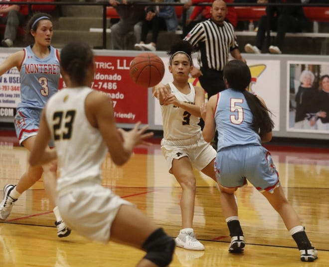 Amarillo High player Jada Graves passes the ball to a teammate during Thursday's playoff contest versus Lubbock Monterey in Shallowater. [Mark Rogers/for the Amarillo Globe-News]