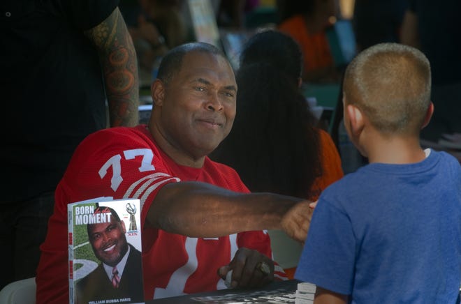 Former San Francisco 49er Bubba Paris greets fans at the Great Valley Bookfest in Manteca in 2015. Paris will be the keynote speaker at a free summit, The Ripple Effect — a Community Faith Summit, from 6-7:30 p.m. March 4.