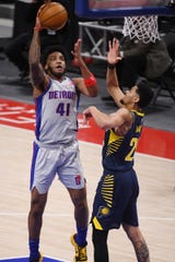 Detroit Pistons forward Saddiq Bey (41) drives to the basket against Indiana Pacers guard Jeremy Lamb (26) during the second quarter at Little Caesars Arena in Detroit on Thursday, Feb. 11, 2021.
