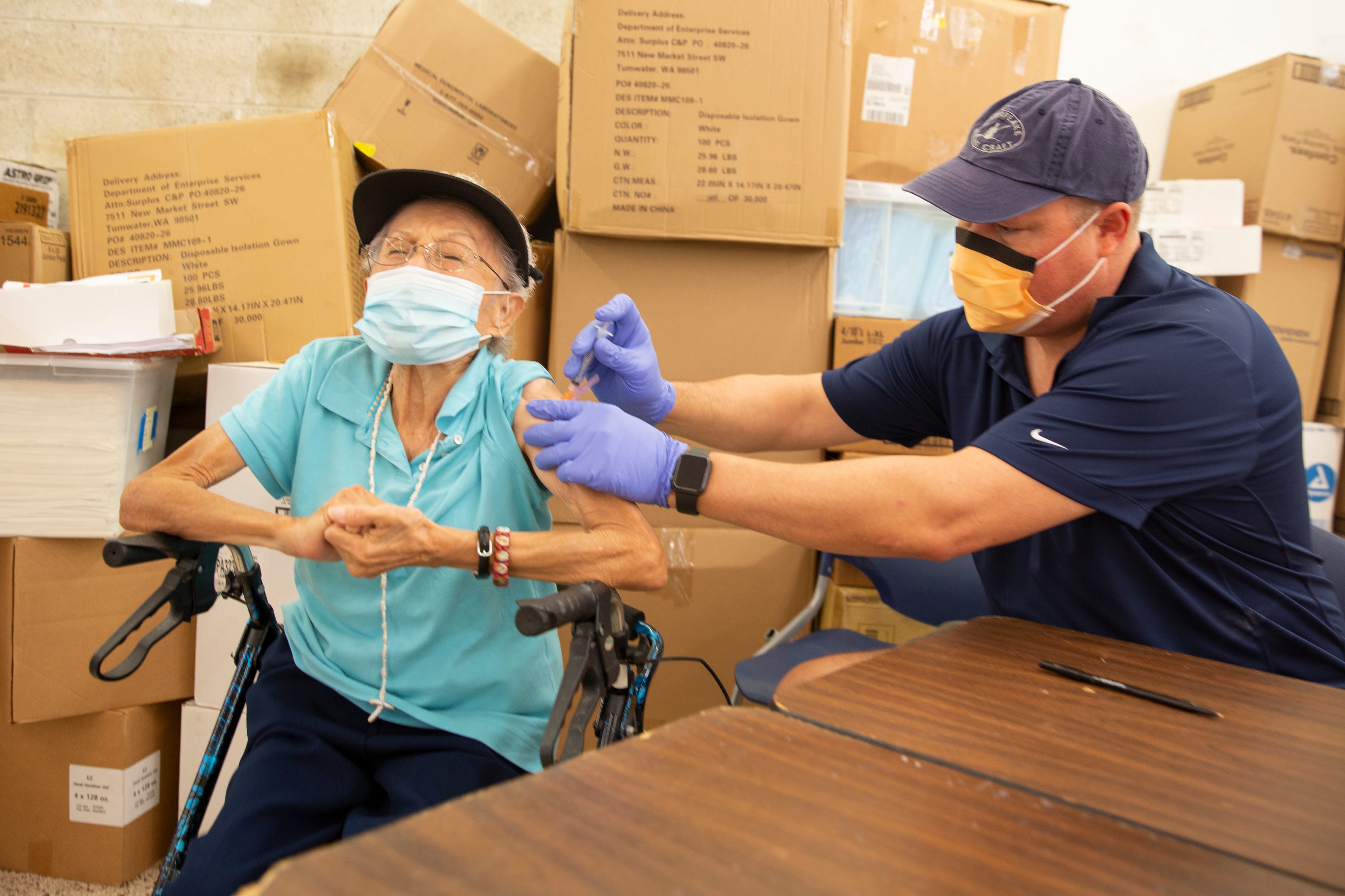 Agnes Barrera, of Immokalee, receives her COVID-19 vaccine by Healthcare Network Dr. Douglas Halbert Tuesday, Feb. 9, 2021, in Immokalee.