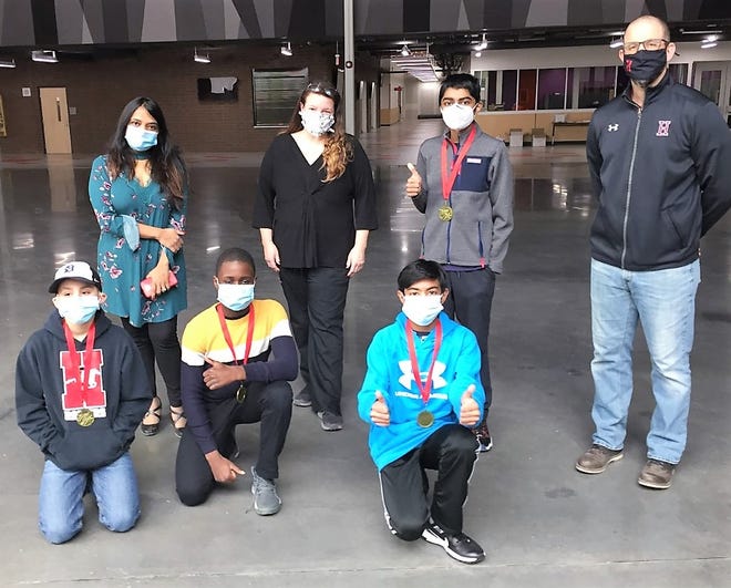 Pictured are members of the third-place team along with their support staff. Pictured (back row from left) are Dr. Anvita Bitta Saini, Hillside teacher Deborah Cannistraro-Hall, Arjun Saini (team lead), Hillside Principal William Jones, (front row from left) Chet Sands, Iyi Akinyemi and Ritvik Ellendula.