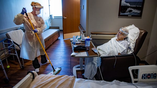 Sherry Weitzel dawns full PPE to clean COVID-19 pa