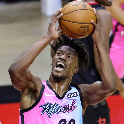Heat forward Jimmy Butler (22) goes up for a shot 
