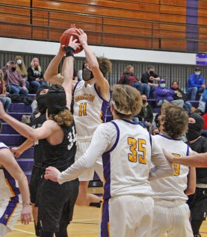 Bronson's Mason Harris (11) takes the ball up in a crowd during the Vikings win over Union City Friday night.