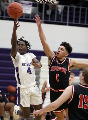 Burlington High School's Trent Burnett (4) puts up a shot while guarded by Miles Dear (1) during their game against Fort Madison High School, Friday Feb. 12, 2021 at BHS.  