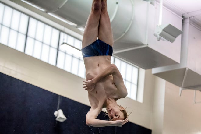Harper Creek's Kevin Tiles competes in the 1-meter dive on Saturday, Feb. 13, 2021 during the All-City Swim Meet at Battle Creek Central High School.