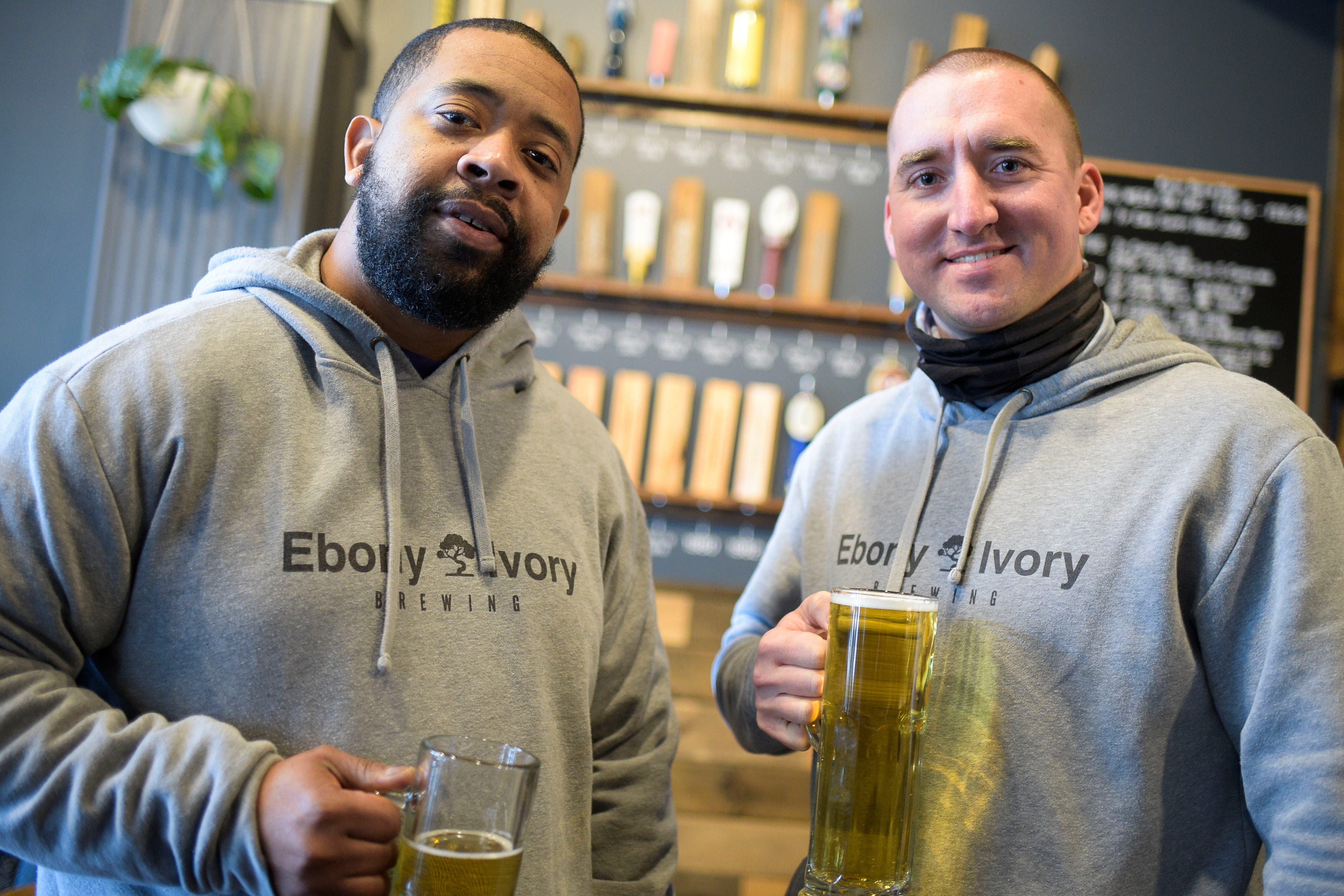 Ebony Ivory Brewing owners Chico Dupas, left, and Mitchell Russell pose for a portrait at Knox Brew Hub in downtown Knoxville, Tenn. on Saturday, Feb. 13, 2021.