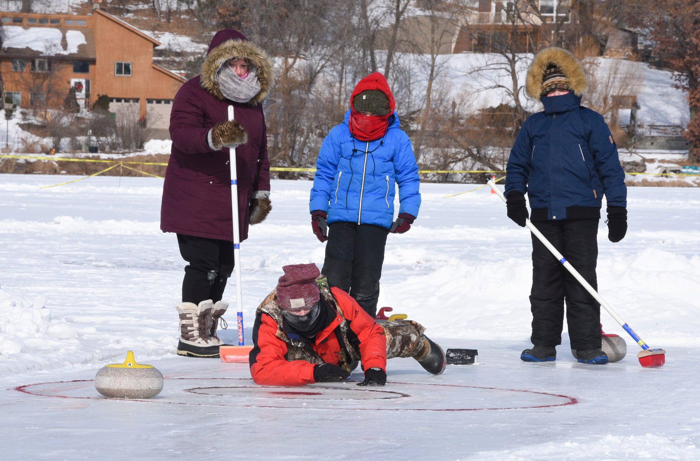 Participants take part in a curling demonstration Saturday, Feb. 13, 2021, at Ice Fest in Little Falls.