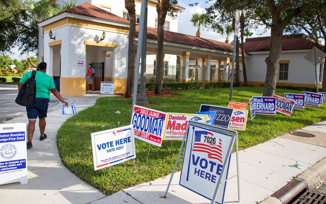 A voter enters the polling place at the Lindsey Davis Senior Community Center in Riviera Beach Tuesday, Nov. 3, 2020. 