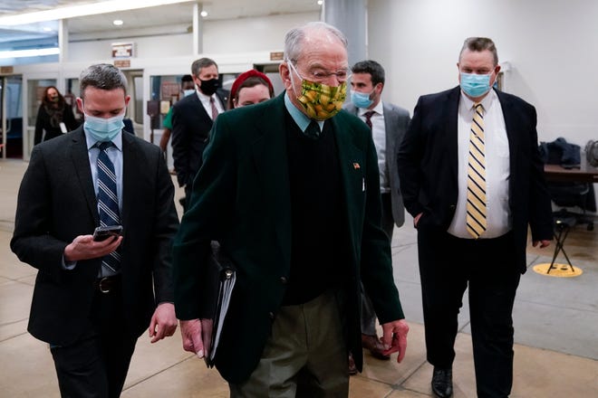 Sen. Chuck Grassley, R-Iowa, walks on Capitol Hill in Washington, Saturday, Feb. 13, 2021, on the fifth day of the second impeachment trial of former President Donald Trump. (AP Photo/Alex Brandon)