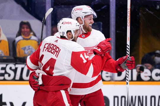 Detroit Red Wings center Robby Fabbri (14) celebrates with Anthony Mantha (39) after Fabbri scored a goal against the Nashville Predators in the first period Saturday, Feb. 13, 2021, in Nashville, Tenn.