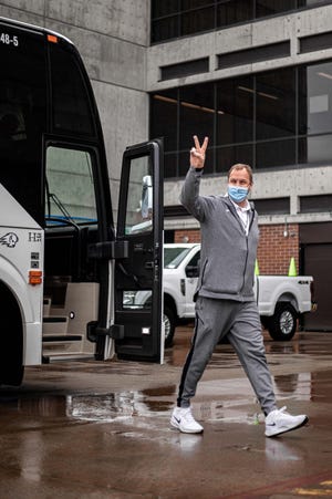 Dixie State coach Jon Judkins exist the bus ahead of DSU's shootaround at Utah Valley.