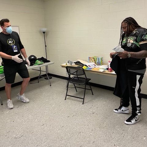Marshawn Lynch suits up before the Beasts' Fan Con