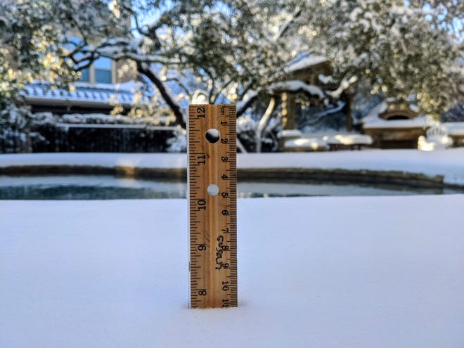 The National Weather Service has received reports from around Central Texas of snowfall totals as high as half a foot. Residents in Bee Cave, Lakeway in western Travis County received 7.5 inches of snow.