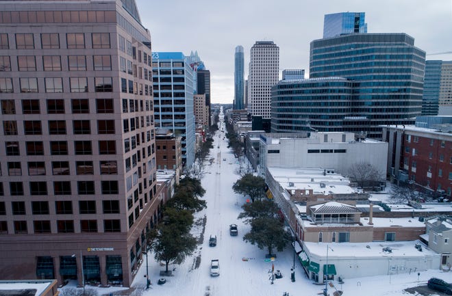 Congress Avenue is covered in snow on Monday February 15, 2021. 
