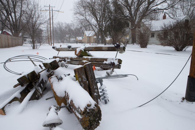 Utility work in Topeka is covered in snow during a rash of sub-zero temperatures that led to power shortages. Residents are bracing for an increase in their monthly energy costs due to the cold weather.
