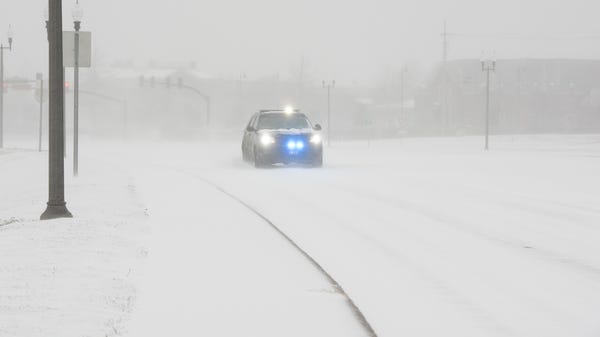 A Madison Police Department vehicle using lights a
