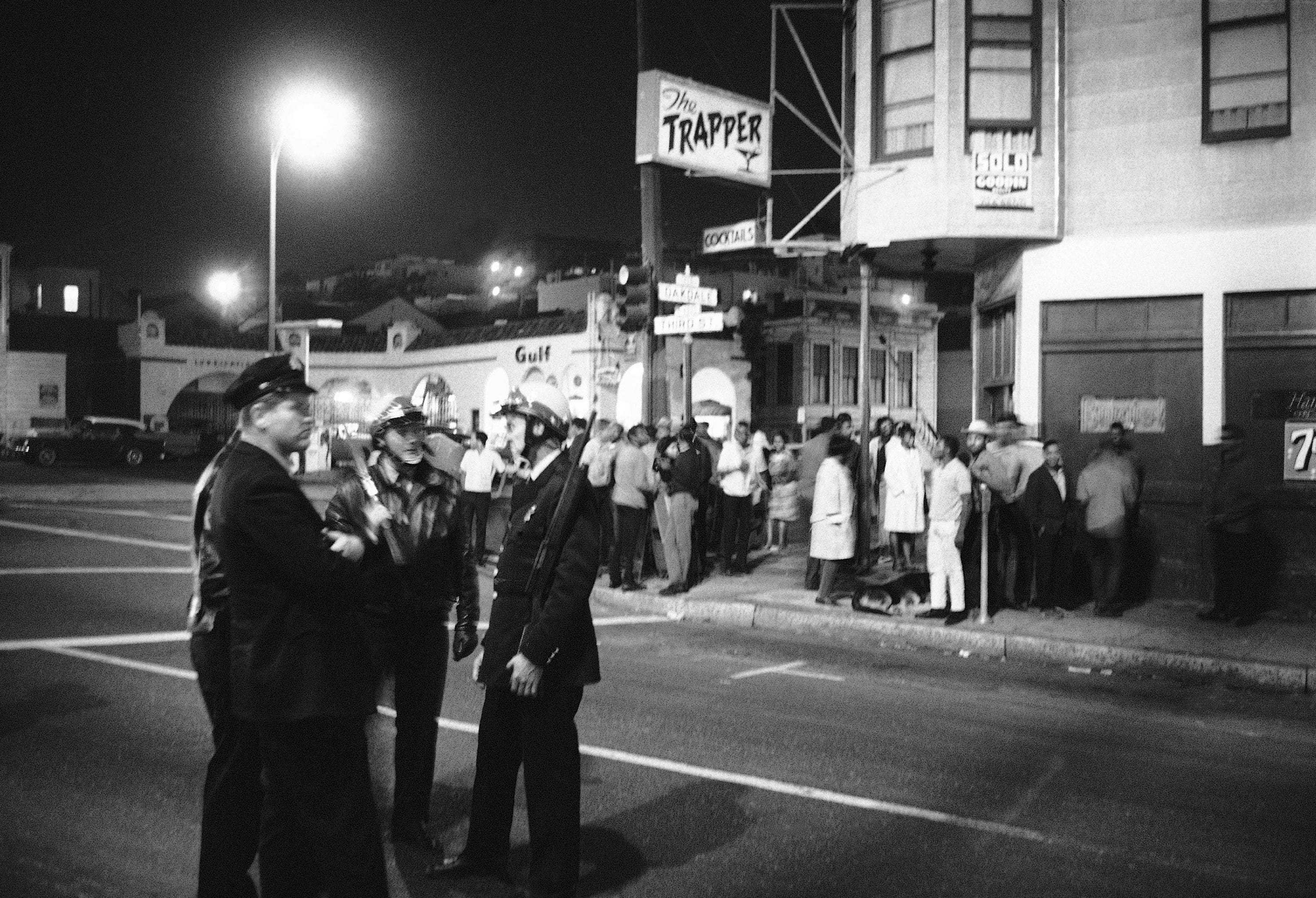 San Francisco police stand guard at Oakdale and Third Street in the aftermath of the fatal shooting of a 16-year-old by a police officer, Sept. 28, 1966.