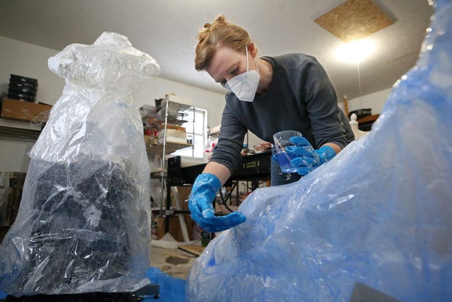 Stow artist Alana Powell works on one of the pieces she is creating for the city's first women-only public art project in March for Women's History Month.
