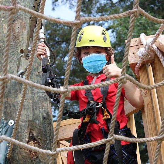 The Adventure Center of Asheville, which includes ziplines and canopy adventures reopened with COVID-19 protocols, including wearing face coverings, social distancing and extensive cleaning procedures.