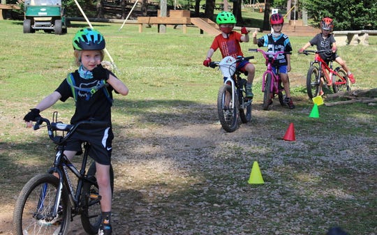 Day campers ride bikes at the Kolo Bike Camp