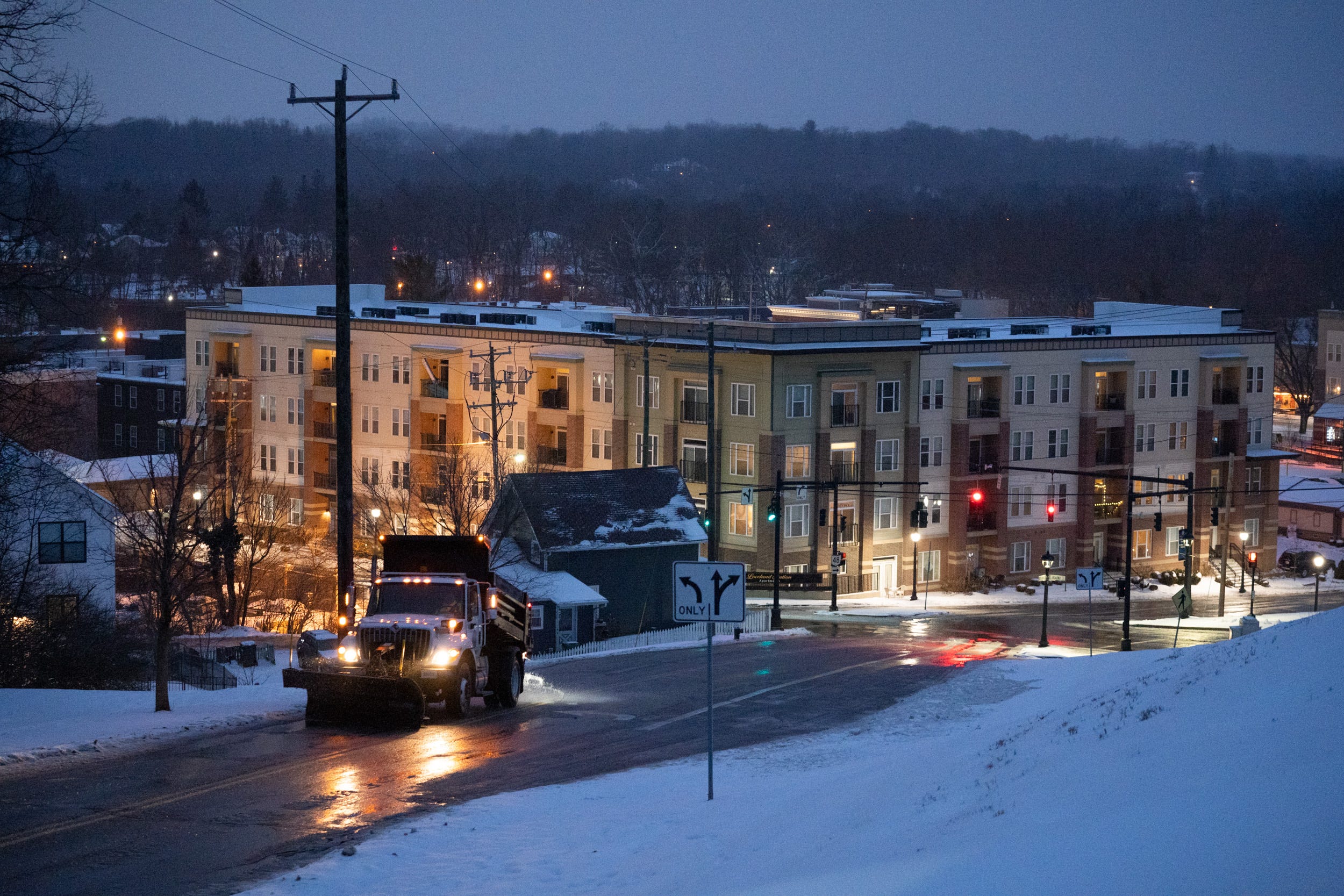 Sowders’ snowplow is one of the few vehicles braving the storm as he plows ice and spreads salt up one of Loveland’s biggest hills at the Broadway Street and State Route 48 intersection. “The only bad thing about there not being many cars on the road is that they help move, track, and spread the salt a little better,” he explains. “I’ve never seen this small amount of people out on the roads. Usually, at this time of day (5 p.m.) it sucks, but it looks like people actually heeded the warnings this time around.”